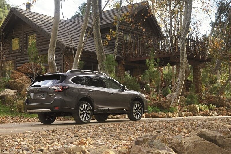 Subaru in front of cabin