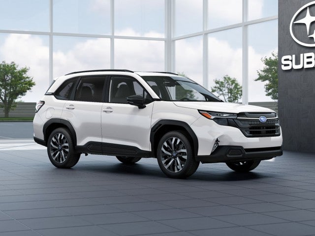 2026 Subaru FORESTER Touring in Crystal White Pearl — front three-quarter view